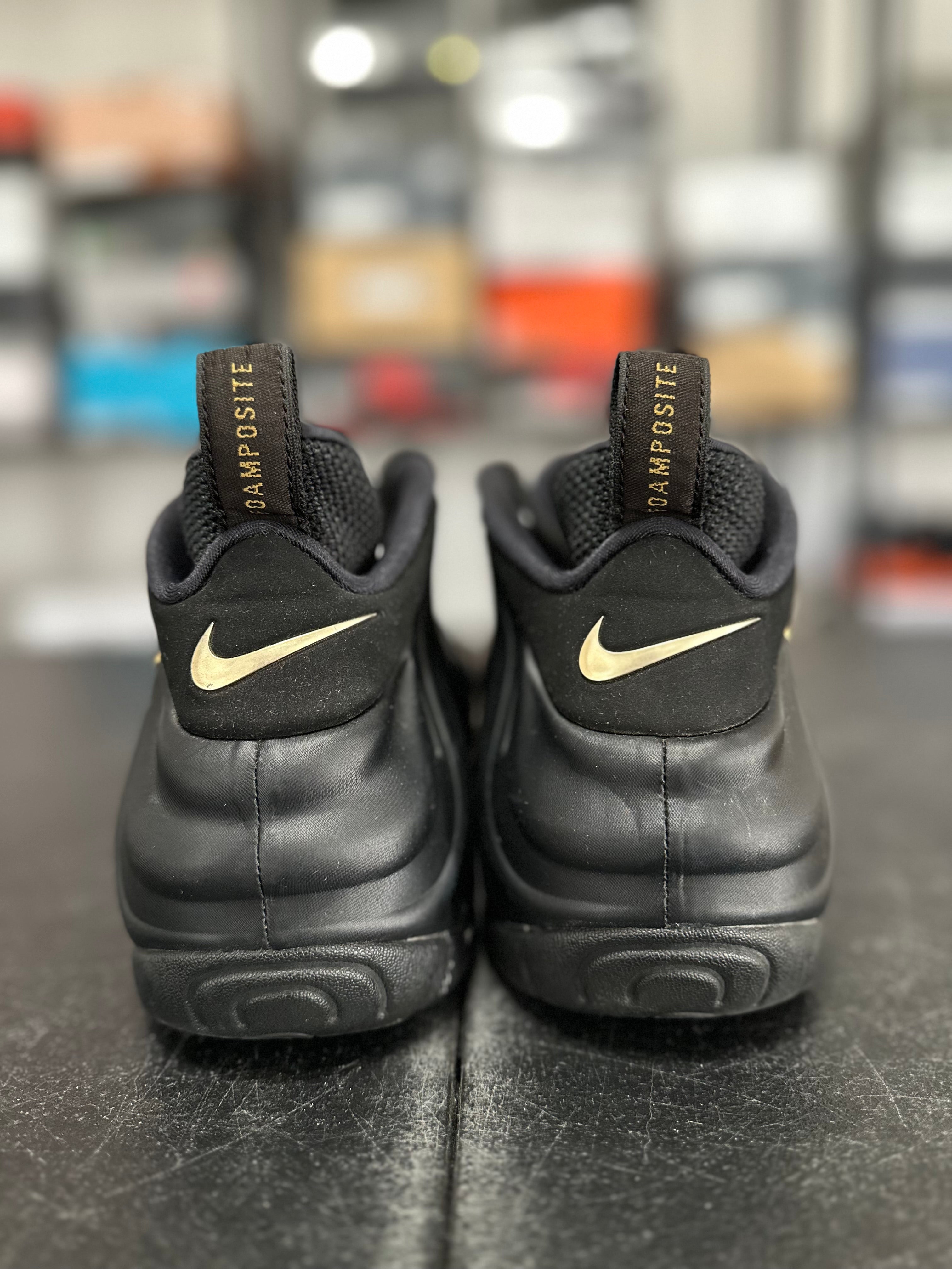 Size 10.5 - Foamposite black metallic gold