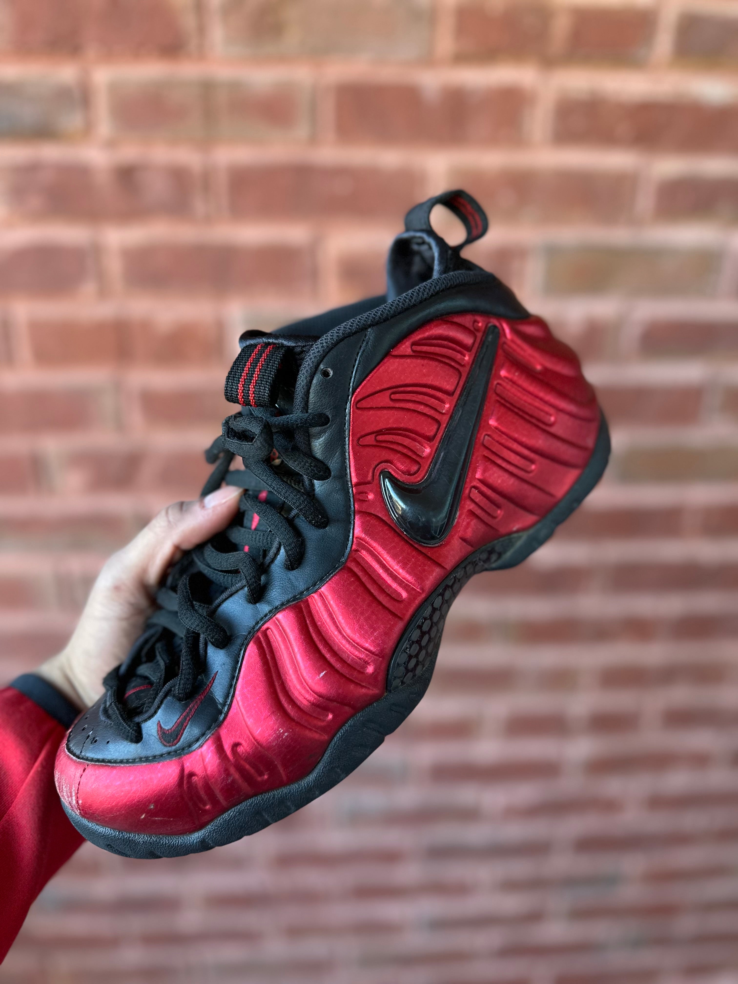 Size 8.5 - air foamposite pro university red