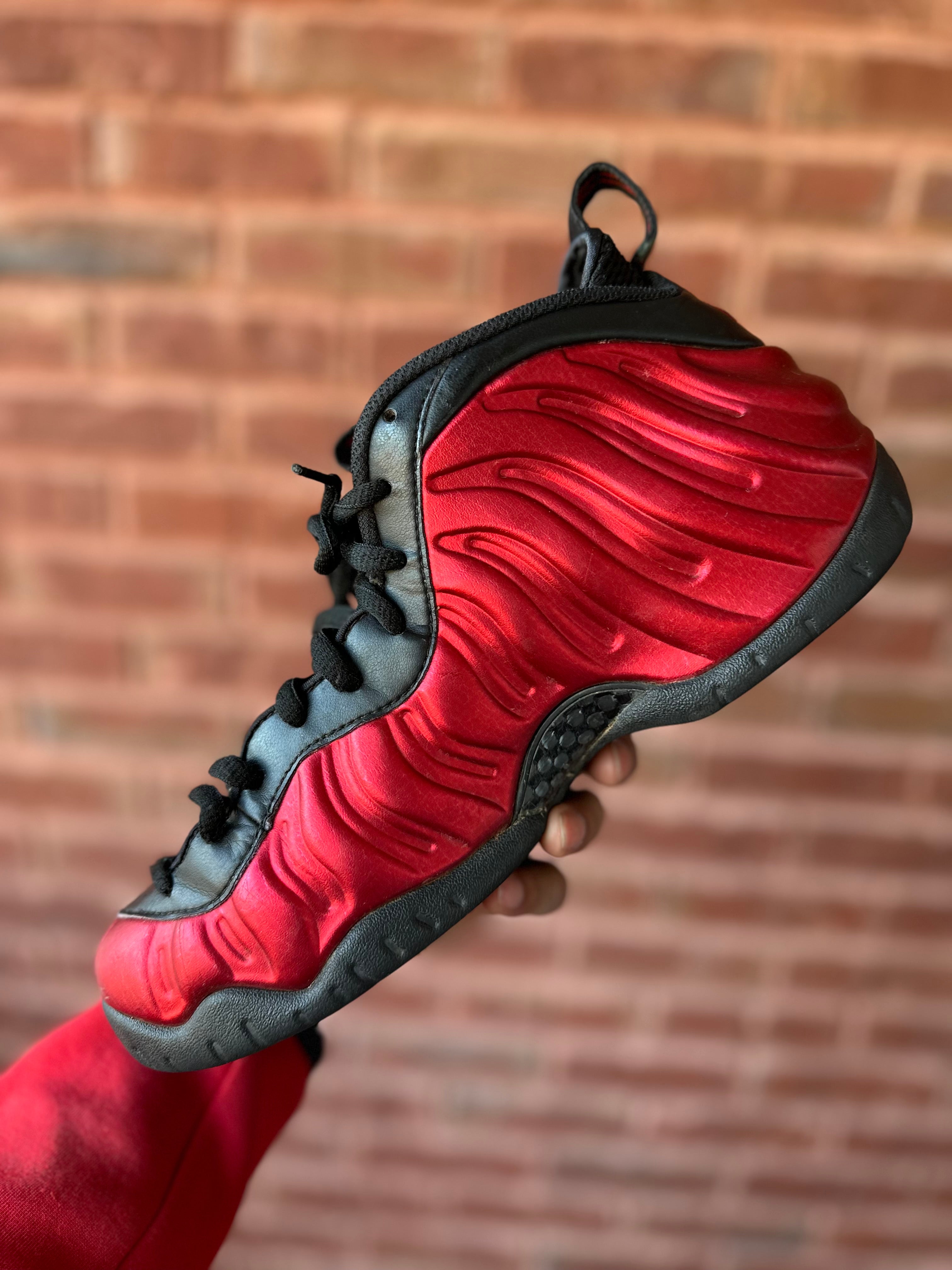 Size 8.5 - air foamposite pro university red